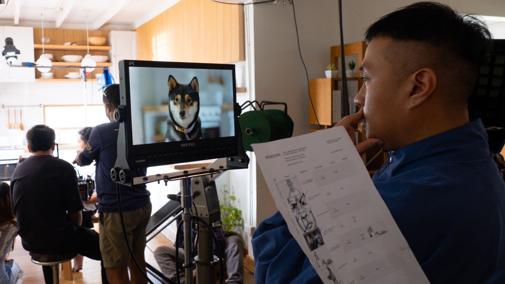 Behind the scenes: reviewing footage on set