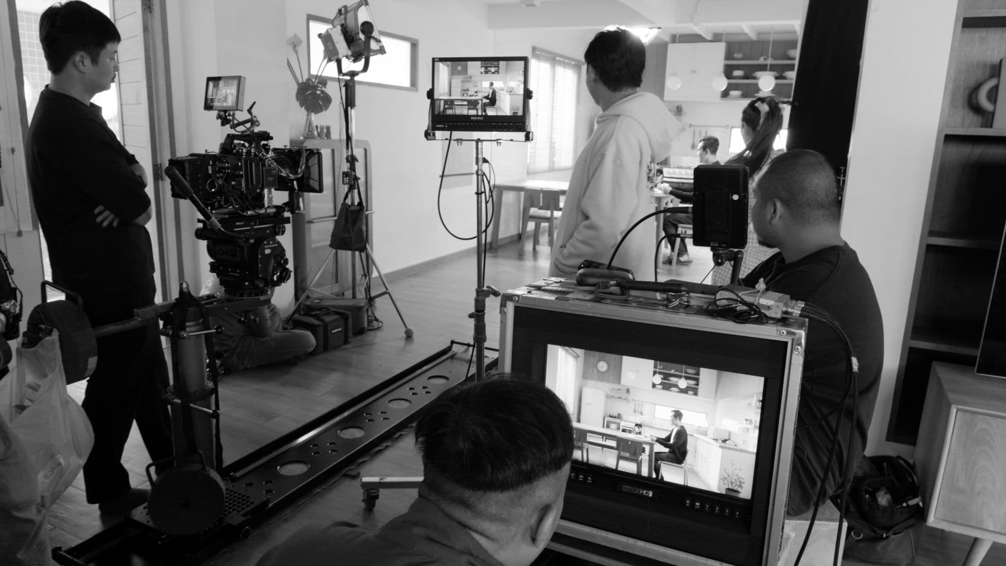 Behind the scenes: crew operating camera dolly